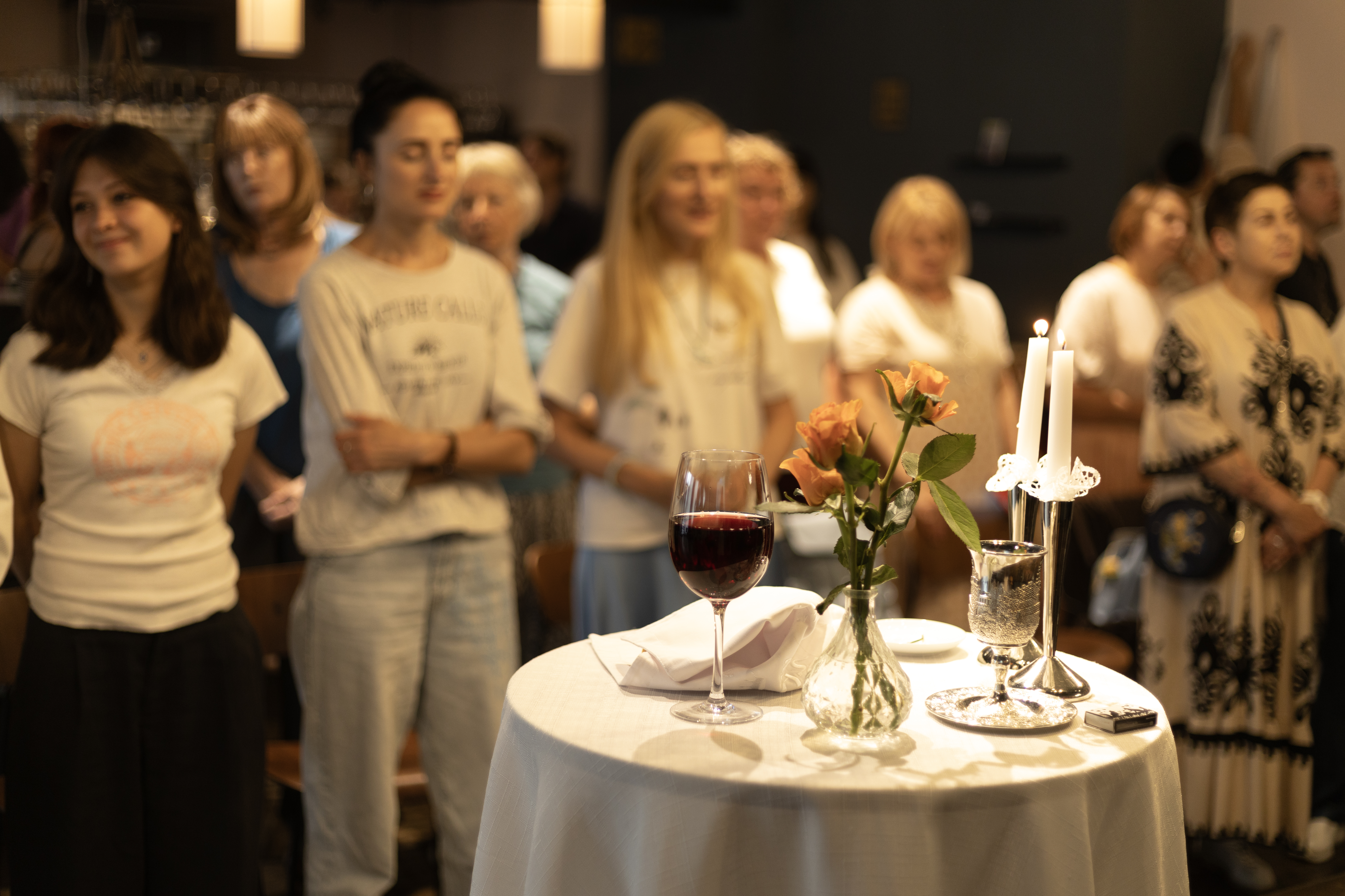 Intergenerational Jewish community sharing a warm meal together in Switzerland